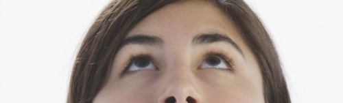 Lady looks up in prayer